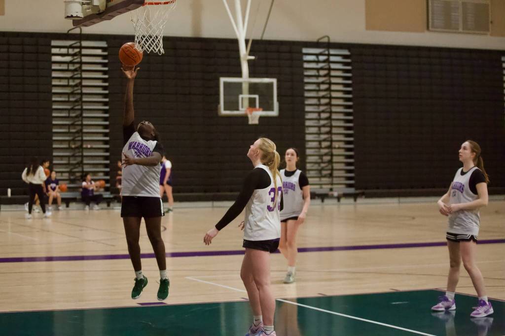 Edmonds-Woodway freshman Zaniyah Jones elevates for a layup during a practice at the Edmonds-Woodway High School gymnasium on Jan. 8, 2026. (Joe Pohoryles / The Herald)