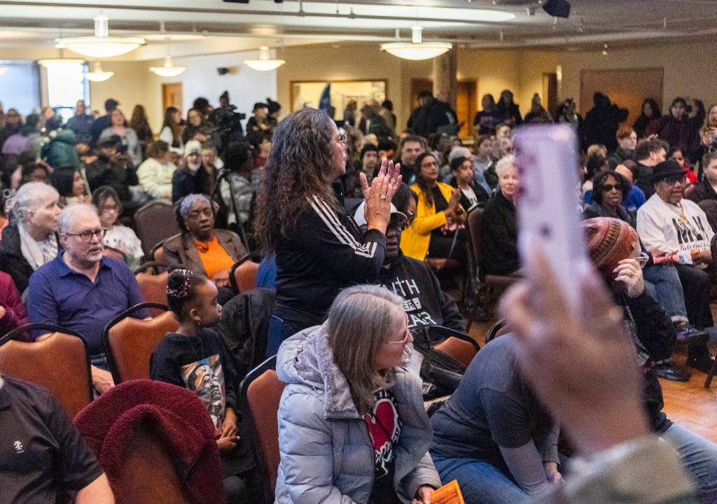 People gather in the Carl Gipson Center after a Martin Luther King Jr. Day march on Monday, Jan. 19, 2026, in Everett, Washington. (Olivia Vanni / The Herald)