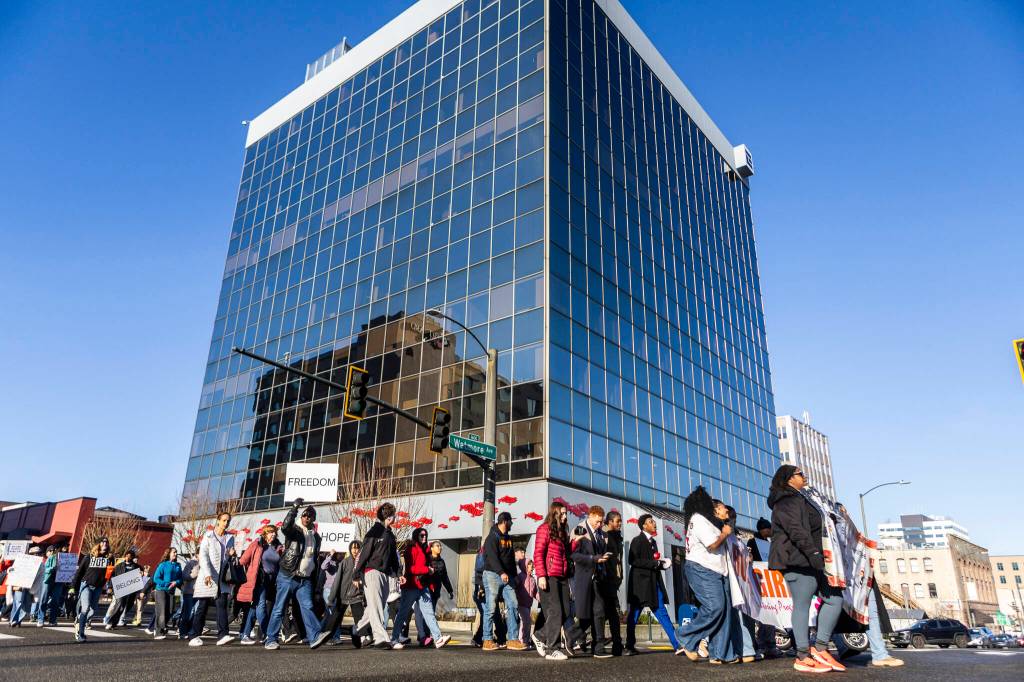 People walk along Wall Street during a Martin Luther King Jr. Day march on Monday, Jan. 19, 2026, in Everett, Washington. (Olivia Vanni / The Herald)