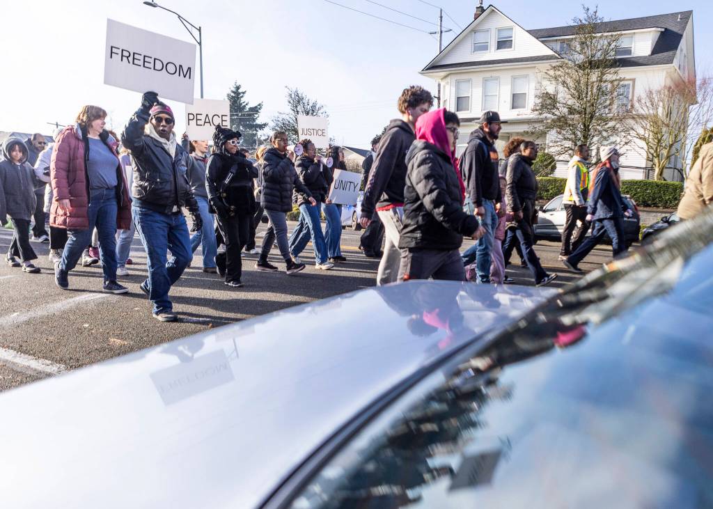 People walk down Colby Avenue in a Martin Luther King Jr. Day march on Monday, Jan. 19, 2026, in Everett, Washington. (Olivia Vanni / The Herald)