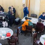 People receive assistance at the Disaster Assistance Center set up at the Volunteers of America Sky Valley Center on Wednesday, Jan. 14, 2026 in Sultan, Washington. (Olivia Vanni / The Herald)