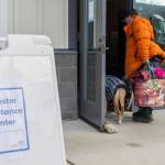 Bill Green walks into the Disaster Assistance Center with his dog Malaki on Wednesday, Jan. 14, 2026 in Sultan, Washington. (Olivia Vanni / The Herald)