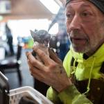 Kevin Stevens holds his Chihuahua puppy inside the Disaster Assistance Center on Wednesday, Jan. 14, 2026 in Sultan, Washington. (Olivia Vanni / The Herald)