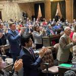 Democrats stand and clap, as Republicans remain in their chairs during Gov. Bob Fergusons State of the State address on Jan. 13, 2026. (Photo by Jerry Cornfield/Washington State Standard)