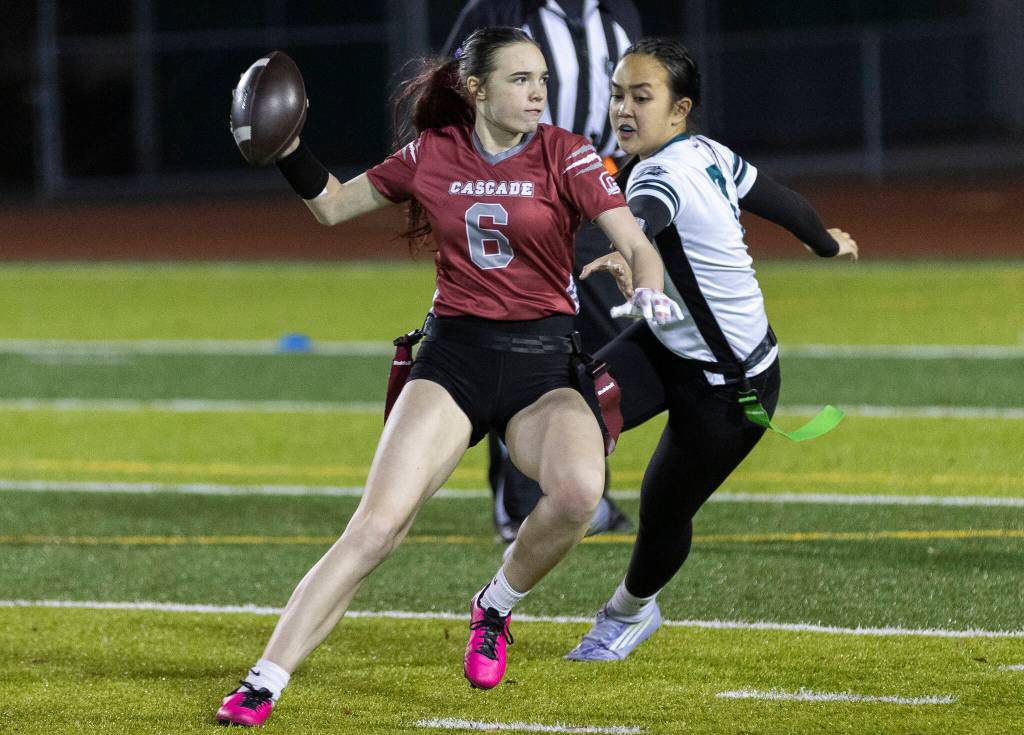 Cascades Khloe Ivey scrambles with the ball against Jackson during the game on Wednesday, Jan. 14, 2026 in Everett, Washington. (Olivia Vanni / The Herald)