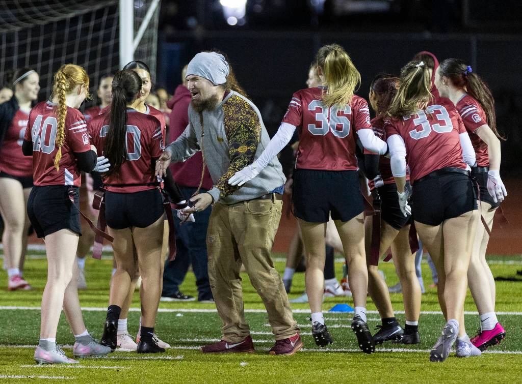 Cascade players celebrate beating Jackson on Wednesday, Jan. 14, 2026 in Everett, Washington. (Olivia Vanni / The Herald)