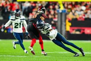 Seahawks cornerback Riq Woolen (27) tackles San Francisco 49ers receiver Jauan Jennings (15) during a game at Levi's Stadium in Santa Clara, California on Saturday, Jan. 3, 2025. (Photo courtesy of the Seattle Seahawks)