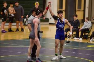 Meadowdale's Chris Ramirez (right) is signaled as the winner of the 144-pound match against Shorecrest's Neta Navot in the Mavericks' 43-34 win against the Scots at Shorecrest High School on Jan. 15, 2026. (Joe Pohoryles / The Herald)