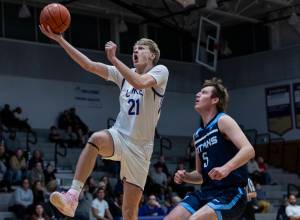 Lake Stevens’ Gabe Allinson makes a layup against Tenison Woods during the game on Dec. 2, 2025 in Lake Stevens, Washington. (Olivia Vanni / The Herald)