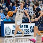 Glacier Peaks Reed Nagel takes the ball up the court against Arlingtons Maveric Vaden during the game on Friday, Jan. 16, 2026 in Snohomish, Washington. (Olivia Vanni / The Herald)
