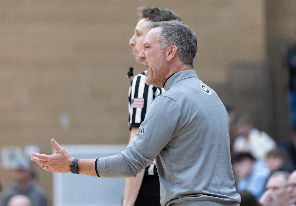Glacier Peak head coach Brian Hunter reacts to a foul called on one of his player during the game against Arlington on Friday, Jan. 16, 2026 in Snohomish, Washington. (Olivia Vanni / The Herald)