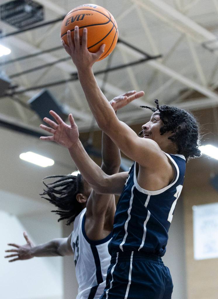 Arlingtons Mac Crews makes a layup during the game against Glacier Peak on Friday, Jan. 16, 2026 in Snohomish, Washington. (Olivia Vanni / The Herald)