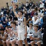 The Glacier Peak bench reacts to a three point basket during the game against Arlington on Friday, Jan. 16, 2026 in Snohomish, Washington. (Olivia Vanni / The Herald)
