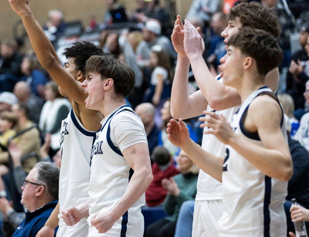The Glacier Peak bench reacts to a shot during the game against Arlington on Friday, Jan. 16, 2026 in Snohomish, Washington. (Olivia Vanni / The Herald)