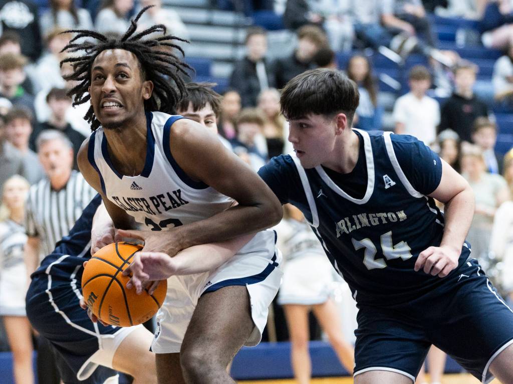 Glacier Peaks Paulos Mulugeta controls the ball against Arlingtons Hudson Miller during the game on Friday, Jan. 16, 2026 in Snohomish, Washington. (Olivia Vanni / The Herald)