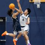 Glacier Peaks Edison Kan blocks a shot by Arlingtons Mac Crews during the game on Friday, Jan. 16, 2026 in Snohomish, Washington. (Olivia Vanni / The Herald)