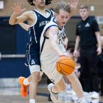 Glacier Peaks Reed Nagel controls the ball against Arlingtons Mac Crews during the game on Friday, Jan. 16, 2026 in Snohomish, Washington. (Olivia Vanni / The Herald)