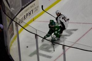 Silvertips forward Nolan Chastko fends off Vancouver defenseman Ethan Mittelsteadt going after a loose puck in the corner during Everett's 4-1 win at Angel of the Winds Arena on Jan. 17, 2026. (Joe Pohoryles / The Herald)