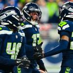 Seattle Seahawks linebacker Ernest Jones IV (13) greets Riq Woolen (27) after intercepting a pass against the San Francisco 49ers on Saturday, Jan. 17, 2026 at Lumen Field in Seattle, Washington. (Photo courtesy of the Seattle Seahawks)