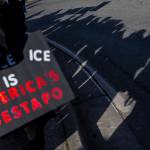 People wave signs during South Snohomish County Indivisibles Signs of Fascism protest on Tuesday, Jan. 20, 2026 in Edmonds, Washington. (Olivia Vanni / The Herald)