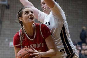 Stanwood’s Stella Berrett tries to take a shot during the game against Arlington on Dec. 3, 2025 in Arlington, Washington. (Olivia Vanni / The Herald)
