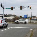 A car idles at a stop light at the intersection of 196th Street and Poplar Way where the City of Lynnwood will be building a bridge over I-5 to connect Poplar Way to Alderwood Mall Boulevard on Monday, Jan. 26, 2026 in Lynnwood, Washington. (Olivia Vanni / The Herald)