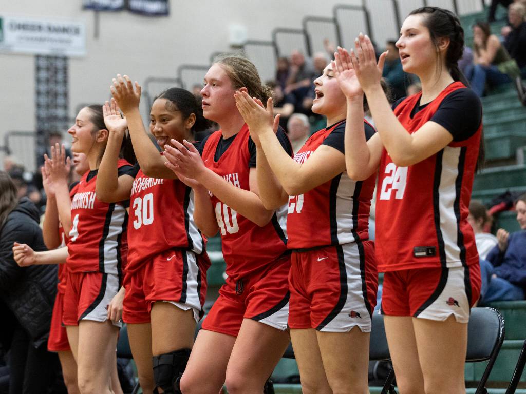 The Snohomish bench reacts to a three-point shot during the game against Jackson on Thursday, Jan. 22, 2026 in Mill Creek, Washington. (Olivia Vanni / The Herald)