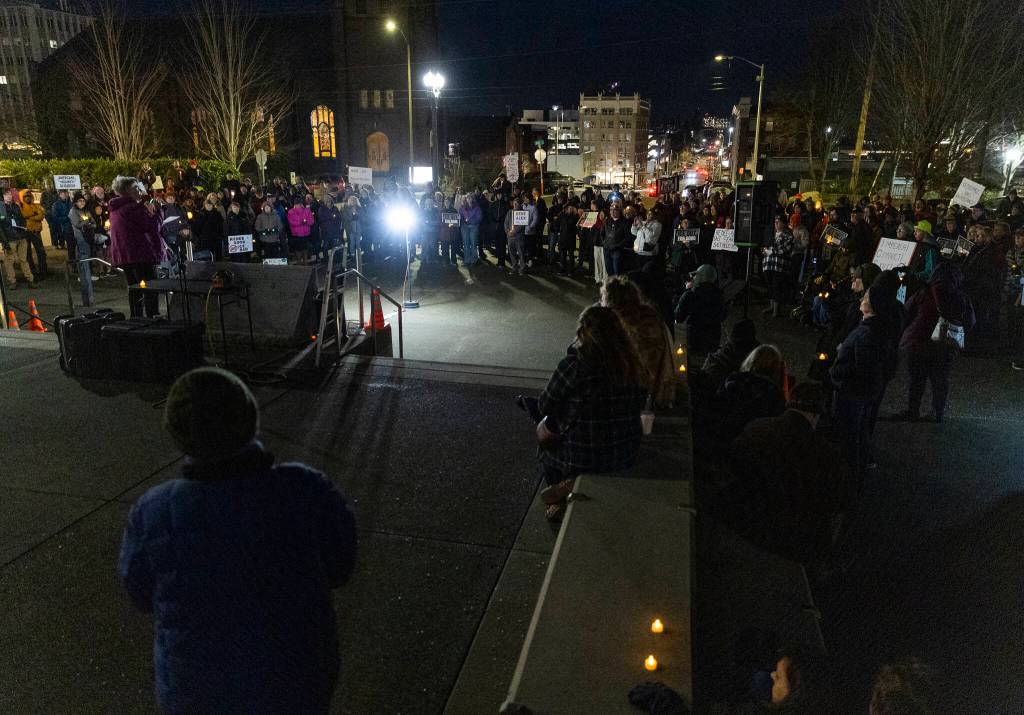 People gather during a vigil held at the Snohomish County Campus as a show of solidarity with the city of Minneapolis as the Midwest city faces a dramatic uptick in immigration enforcement on Tuesday, Jan. 27, 2026, in Everett, Washington. (Olivia Vanni / The Herald)