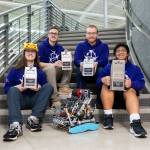 Lake Stevens robotics team 8931R (Arsenic) Colwyn Roberts, Riley Walrod, Corbin Kingston and Chris Rapues with their current robot and awards on Thursday, Jan. 29, 2026 in Lake Stevens, Washington. (Olivia Vanni / The Herald)