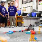 Chris Rapues and Riley Walrod runs their robot through a series of tasks on Thursday, Jan. 29, 2026 in Lake Stevens, Washington. (Olivia Vanni / The Herald)