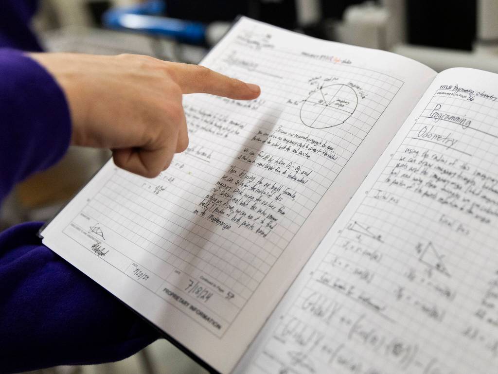 Colwyn Roberts talks about some the teams early odometry calculations for their robot on Thursday, Jan. 29, 2026 in Lake Stevens, Washington. (Olivia Vanni / The Herald)