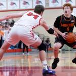 Monroes Tate Hammerquist looks to shoot the ball against Snohomishs Luke Davis during the game on Wednesday, Jan. 28, 2026 in Snohomish, Washington. (Olivia Vanni / The Herald)