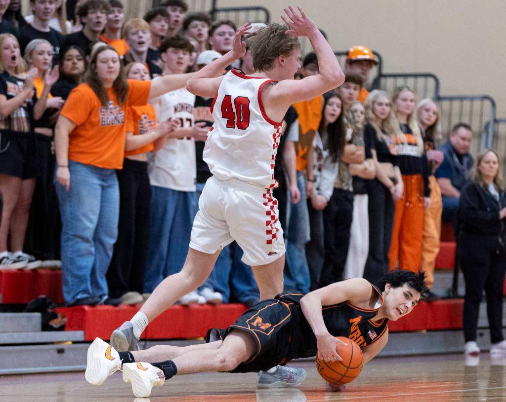 Snohomishs Hudson Smith reacts to a foul being called on him while Monroes Dominic Castillo falls to the ground during the game on Wednesday, Jan. 28, 2026 in Snohomish, Washington. (Olivia Vanni / The Herald)