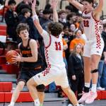 Monroes Wyatt Prohn looks to pass the ball while being guarded by Snohomishs Grady Rohrich and Deyton Wheat during the game on Wednesday, Jan. 28, 2026 in Snohomish, Washington. (Olivia Vanni / The Herald)