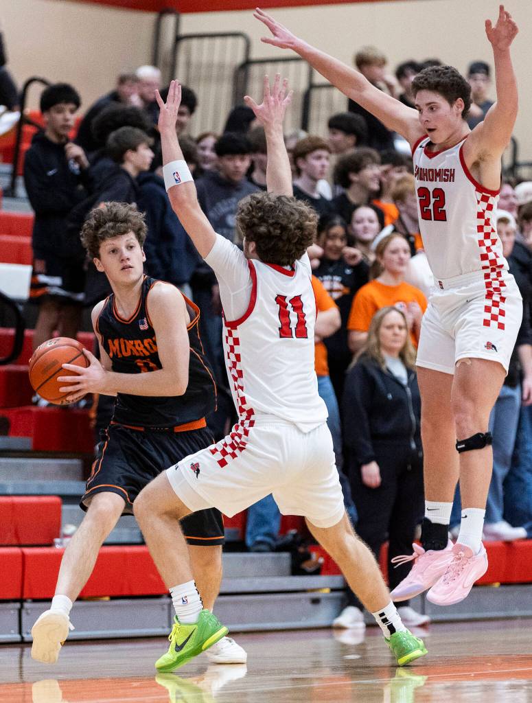 Monroes Wyatt Prohn looks to pass the ball while being guarded by Snohomishs Grady Rohrich and Deyton Wheat during the game on Wednesday, Jan. 28, 2026 in Snohomish, Washington. (Olivia Vanni / The Herald)