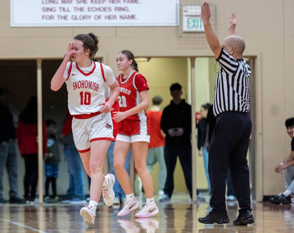 Snohomishs Lizzie Allyn reacts after making a three point shot during the game against Stanwood on Friday, Jan. 30, 2026 in Snohomish, Washington. (Olivia Vanni / The Herald)