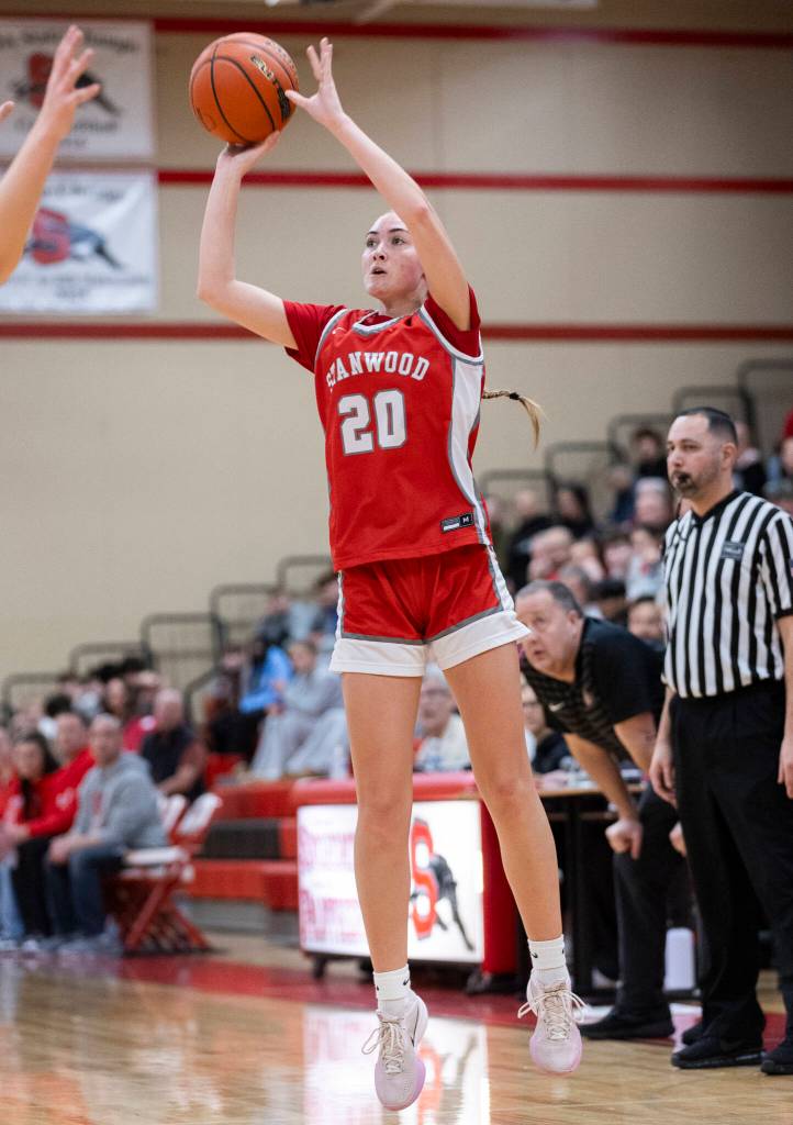 Stanwoods Presley Harris takes a three point shot during the game against Snohomish on Friday, Jan. 30, 2026 in Snohomish, Washington. (Olivia Vanni / The Herald)