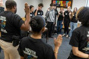 Youth Traffic Court raise their hands to take an oath before the start of the session at the Snohomish County Courthouse on Friday, Jan. 30, 2026 in Everett, Washington. (Olivia Vanni / The Herald)