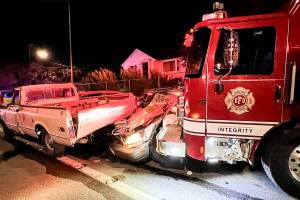 An Everett Fire Department engine rests against a pile of wrecked vehicles after being abandoned by a suspect who stole it and caused significant damage while driving through North Everett late Friday night, July 18, 2025, in Everett, Washington. (Provided photo)