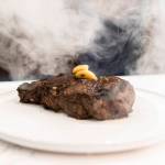 Whiskey Prime Steakhouses 18-ounce Chairman steak with garlic confit, 12-year aged balsamic vinegar and bourbon-soaked oak at the Angel of the Winds Casino Resort on Thursday, Jan. 29, 2026 in Arlington, Washington. (Olivia Vanni / The Herald)
