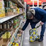 Art Chavez of Everett picks out a selection of pasta from an aisle inside the Grocery Outlet on Tuesday, Feb. 10, 2026 in Everett, Washington. (Olivia Vanni / The Herald)