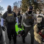Federal agents arrest a protester during an active immigration enforcement operation in a Minneapolis neighborhood, on Jan. 13. The chief federal judge in Minnesota excoriated Immigration and Customs Enforcement on Wednesday, Jan. 28, saying it had violated nearly 100 court orders stemming from its aggressive crackdown in the state and had disobeyed more judicial directives in January alone than some federal agencies have violated in their entire existence. (David Guttenfelder / The New York Times)