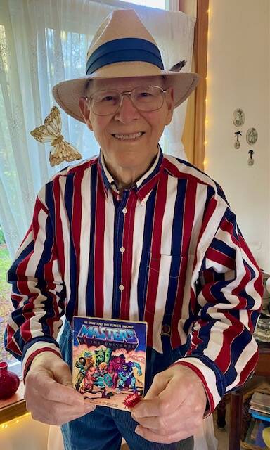 Roger Sweet holding a Masters of the Universe comic he signed for a fan in December 2025. (Provided photo)