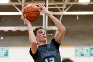 Edmonds-Woodway’s William Alseth makes a jump shot over the top of Shorewood’s Thomas Moles during the game on Tuesday, Feb. 4, 2025 in Shoreline, Washington. (Olivia Vanni / The Herald)