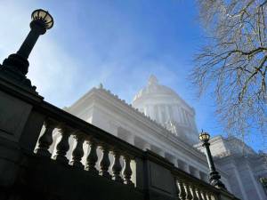 A view of the Washington state Capitol building in Olympia, obscured by a slight mist, Jan. 27, 2025. (Photo by Bill Lucia/Washington State Standard)