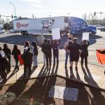 Students holds signs on the corner of 172nd Street Northeast and 27th Avenue Northeast during a student walkout and protest on Thursday, Feb. 5, 2026 in Lakewood, Washington. (Olivia Vanni / The Herald)