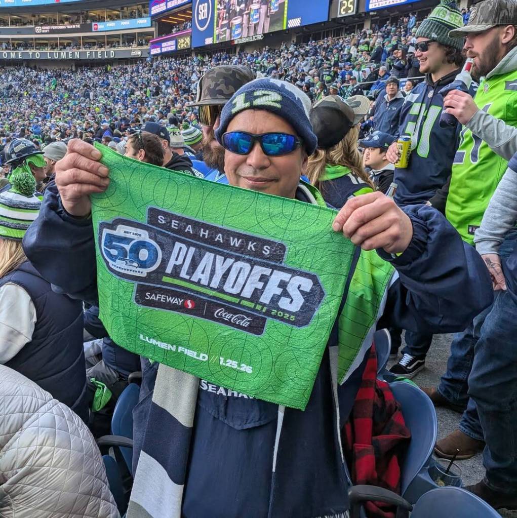Daniel Abad holds up a rally towel during the NFC Championship game between the Seattle Seahawks and Los Angeles Rams at Lumen Field in Seattle, Washington on Sunday, Jan. 25, 2026. (Photo courtesy of Daniel Abad)