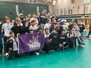 Lake Stevens boys wrestling gathers for a team photo after winning the District 1 4A Tournament at Jackson High School on Feb. 7, 2026. (Joe Pohoryles/The Herald)