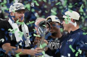 Seahawks quarterback Sam Darnold (left), Super Bowl MVP Kenneth Walker III (center) and head coach Mike Macdonald celebrate with the Lombardi Trophy after defeating the New England Patriots 29-13 at Super Bowl LX at Levi's Stadium in Santa Clara, California on Sunday, Feb. 8, 2026. (Photo courtesy of the Seattle Seahawks)