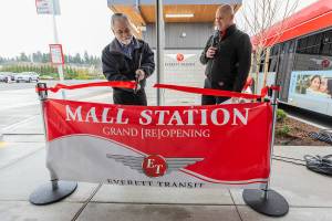 Everett Councilmember Ben Zarlingo cuts the ribbon at the Everett Transit Mall Station grand re-opening on Friday, Feb. 13, 2026 in Everett, Washington. (Olivia Vanni / The Herald)